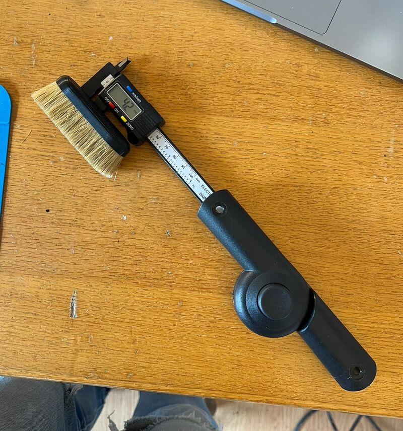 A brush, bristle, calipers and a pivot.