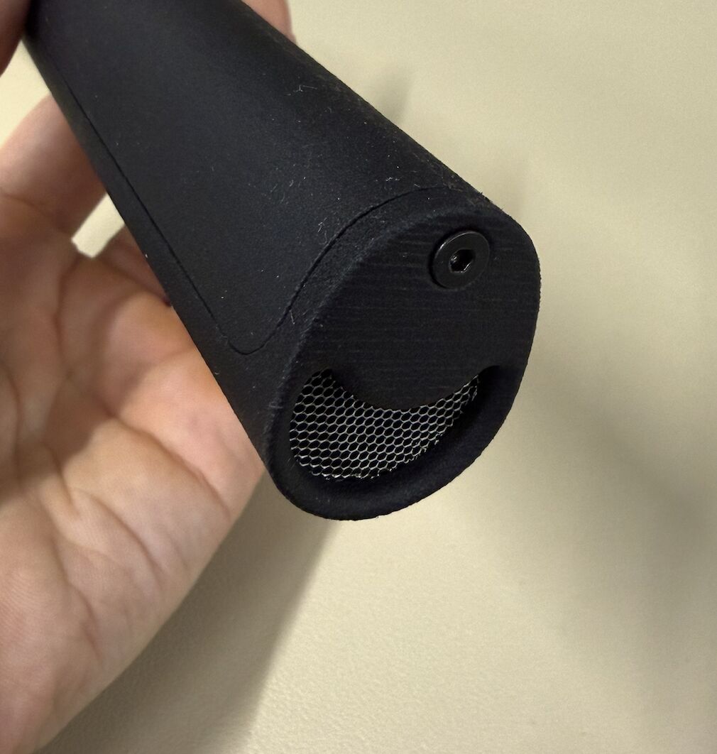 Close-up of the ChalkBlaster V2 handle end showing the crescent-shaped air intake covered by a fine hexagonal stainless steel mesh