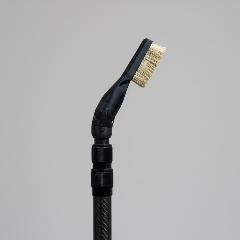 Cleaning brush with a black carbon telescopic handle and boar bristle brush head with pivot mechanism with 15 degree angle