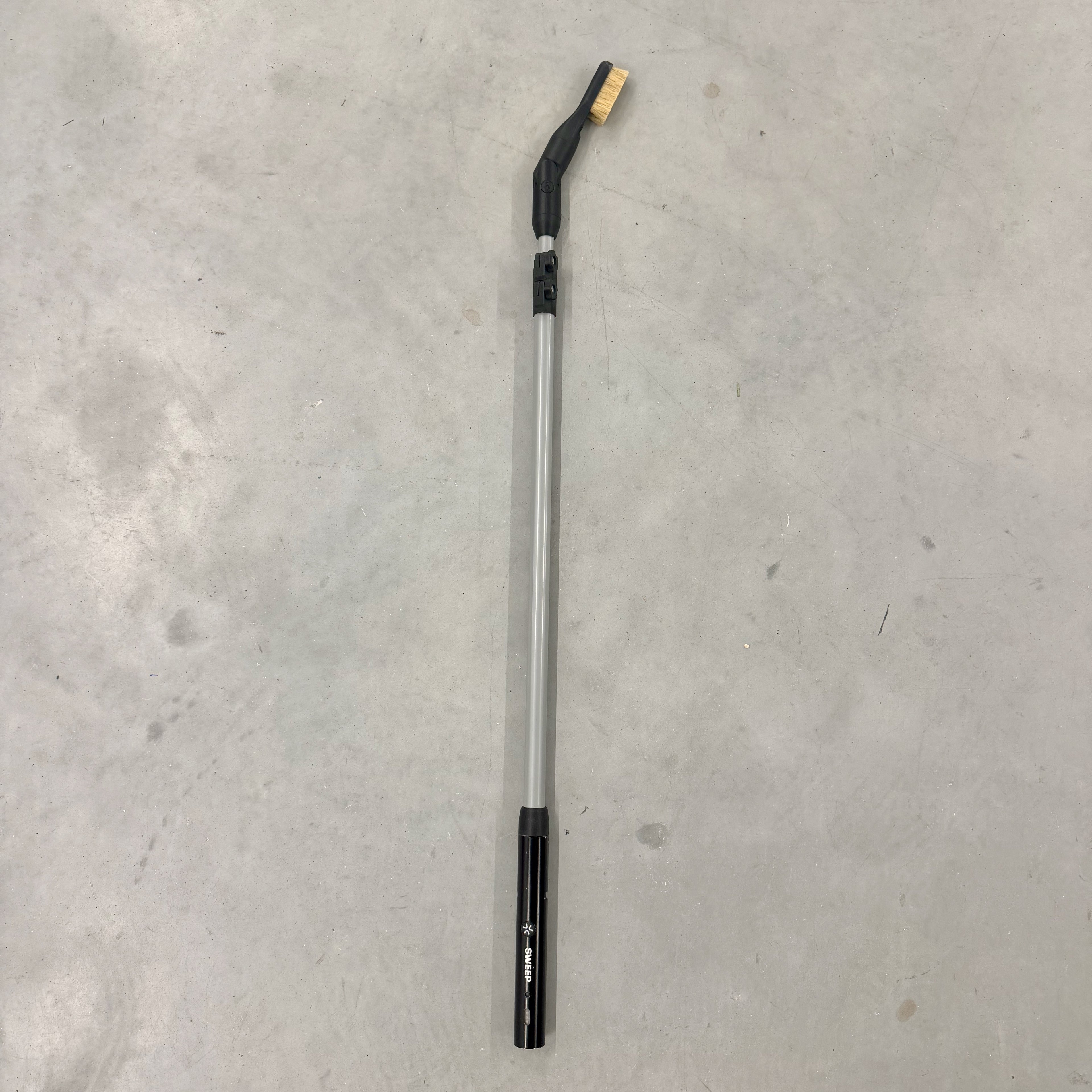 Telescoping pole attachment for the Chalk Blaster showcasing the compact length. It can be extended to reach even higher places.